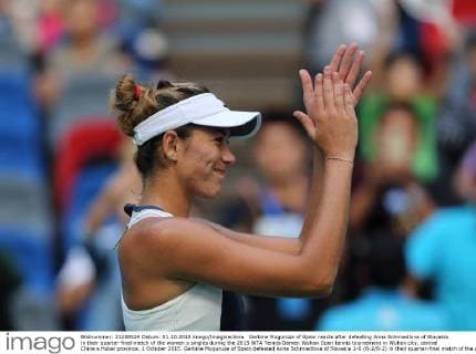 Garbine Muguruza of Spain reacts after defeating Anna Schmiedlova of Slovakia in their quarter-final match of the women s singles during the 2015 WTA Tennis Damen Wuhan Open tennis tournament in Wuhan city, central China s Hubei province, 1 October 2015. Garbine Muguruza of Spain defeated Anna Schmiedlova of Slovakia 2-0 (6-2 6-2) in their quarter-final match of the women s singles during the 2015 WTA Wuhan Open tennis tournament in Wuhan city, central China s Hubei province, on Thursday (1 October 2015). Garbine Muguruza beats Anna Schmiedlova to advance at Wuhan Open  pbu339428_08