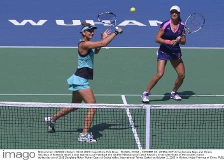 WUHAN, CHINA - OCTOBER 02: (CHINA OUT) Irina-Camelia Begu and Monica Niculescu of Romania return a shot against Lucie Hradecka and Andrea Hlavackova of Czech Republic in the semi-finals of the doubles match during day six of 2015 Dongfeng Motor Wuhan Open at Optics Valley International Tennis Center on October 2, 2015 in Wuhan, Hubei Province of China.  CFP473752277 