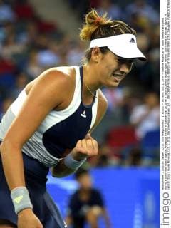 (151002) -- WUHAN, Oct. 2, 2015 -- Garbine Muguruza of Spain celebrates a point during a semi-final match against Angelique Kerber of Germany at 2015 WTA Tennis Damen Wuhan Open Tennis Tournament in Wuhan, capital of central China s Hubei Province, Oct. 2, 2015. Garbine Muguruza won 2-0. ) (SP)CHINA-WUHAN-TENNIS-WTA-WUHAN OPEN (CN) ChengxMin 