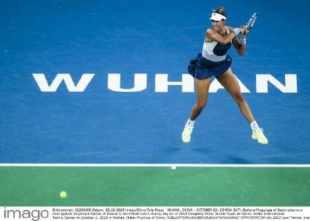 WUHAN, CHINA - OCTOBER 02: (CHINA OUT) Garbine Muguruza of Spain returns a shot against Angelique Kerber of Russia in semi-final match during day six of 2015 Dongfeng Motor Wuhan Open at Optics Valley International Tennis Center on October 2, 2015 in Wuhan, Hubei Province of China.  CFP473769734 