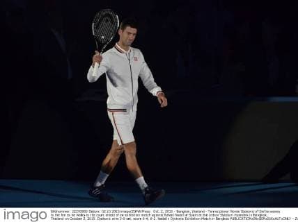 Oct. 2, 2015 - Bangkok, thailand - Tennis player Novak Djokovic of Serbia waves to the fan as he walks to the court ahead of an exhibition match against Rafael Nadal of Spain at the Indoor Stadium Huamark in Bangkok, Thailand on October 2, 2015. Djokovic wins 2-0 set, score 6-4, 6-2. Nadal v Djokovic Exhibition Match in Bangkok  - ZUMAn230
