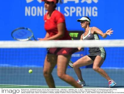 (151003) -- WUHAN, Oct. 3, 2015 -- Martina Hingis(R) of Switzerland and Sania Mirza of India compete during the final match of women s double against Irina-Camelia Begu and Monica Niculescu of Romania at 2015 WTA Tennis Damen Wuhan Open Tennis Tournament in Wuhan, capital of central China s Hubei Province, Oct. 3, 2015. Martina Hingis and Sania Mirza won 2-0 and claimed the title. ) (SP)CHINA-WUHAN-TENNIS-WTA-WUHAN OPEN (CN) ChengxMin 