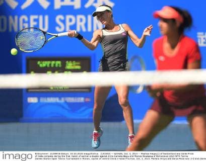 (151003) -- WUHAN, Oct. 3, 2015 -- Martina Hingis(L) of Switzerland and Sania Mirza of India compete during the final match of women s double against Irina-Camelia Begu and Monica Niculescu of Romania at 2015 WTA Tennis Damen Wuhan Open Tennis Tournament in Wuhan, capital of central China s Hubei Province, Oct. 3, 2015. Martina Hingis and Sania Mirza won 2-0 and claimed the title. ) (SP)CHINA-WUHAN-TENNIS-WTA-WUHAN OPEN (CN) ChengxMin 