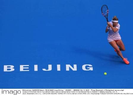 (151003) -- BEIJING, Oct. 3, 2015 -- Timea Bacsinszky of Switzerland returns a ball during a China Open tennis tournament match against Camila Giorgi of Italy at the National Tennis Stadium in Beijing Saturday, Oct. 3, 2015. Bacsinszky won 2-1. ) (SP)CHINA-BEIJING-TENNIS WTA Tennis Damen CHINA OPEN (CN) XingxGuangli 