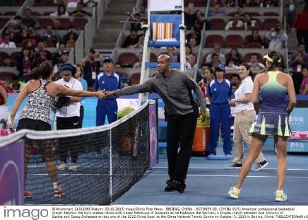 BEIJING, CHINA - OCTOBER 03: (CHINA OUT) American professional basketball player Stephon Marbury shakes hands with Casey Dellacqua of Australia as he highlghts the Women s Singles match between Ana Ivanovic of Serbia and Casey Dellacqua on day one of the 2015 China Open at the China National Tennis Centre on October 3, 2015 in Beijing, China.  CFP473808300 