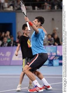 BEIJING, CHINA - OCTOBER 03: (CHINA OUT) Novak Djokovic of Serbia takes part in a charity promotion on day one of the 2015 China Open at the China National Tennis Centre on October 3, 2015 in Beijing, China.  CFP473809518 