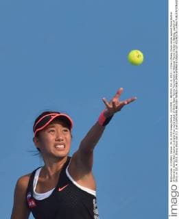 (151004) -- BEIJING, Oct. 4, 2015 -- China s Zhang Shuai serves against Mona Barthel of Germany during their women s singles first round match of China Open Tennis Tournament at National Tennis Center in Beijing, capital of China on Oct. 4, 2015. Zhang Shuai lost 0-2. )(wll) (SP)CHINA-BEIJING-TENNIS-CHINA OPEN-WOMEN S SINGLES-1ST ROUND(CN) LixWen 