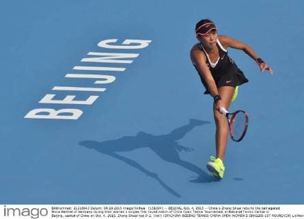 (151004) -- BEIJING, Oct. 4, 2015 -- China s Zhang Shuai returns the ball against Mona Barthel of Germany during their women s singles first round match of China Open Tennis Tournament at National Tennis Center in Beijing, capital of China on Oct. 4, 2015. Zhang Shuai lost 0-2. )(wll) (SP)CHINA-BEIJING-TENNIS-CHINA OPEN-WOMEN S SINGLES-1ST ROUND(CN) LixWen 