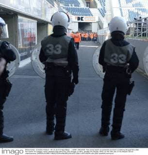 - GENT, BELGIUM: Riot police watch as stewards surround protesting Brugge fans after the Jupiler Pro League match between KAA Gent and Club Brugge, in Gent, Sunday 04 October 2015, on the 10th day of the Belgian soccer championship. JASPERxJACOBS  x04714224x