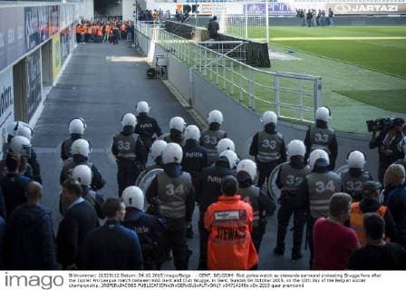 - GENT, BELGIUM: Riot police watch as stewards surround protesting Brugge fans after the Jupiler Pro League match between KAA Gent and Club Brugge, in Gent, Sunday 04 October 2015, on the 10th day of the Belgian soccer championship. JASPERxJACOBS  x04714249x