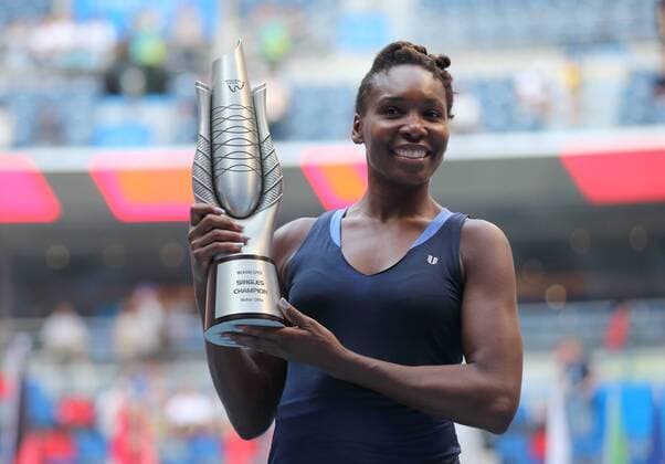Venus Williams of the United States poses with her champion trophy after winning the final match against Garbine Muguruza of Spain during the 2015 WTA Tennis Damen Wuhan Open tennis tournament in Wuhan city, central China s Hubei province, 3 October 2015. Venus Williams won her biggest title in five years at the Wuhan Open on Saturday (3 October 2015) after Garbine Muguruza quitted, making her the fifth player to pull out mid-match in the late-season tournament. Williams took the first set and was three games up in the second when the Spaniard stopped play at 53 minutes, handing the American veteran the 47th title win of her career, and her first victory at a WTA Premier Five event since she beat Victoria Azarenka in 2010 in Dubai. Wimbledon finalist Muguruza, ranked world number eight, 16 places ahead of American veteran Williams, had a tough semi-final against Germany s Angelique Kerber, winning in straight sets but falling during the closing tie break and injuring her ankle. But the 21-year-old said it was exhaustion not injury that made her pull out. Venus wins 47th career title as Muguruza quits Wuhan Open final  pbu340128_15