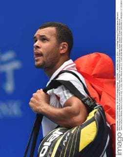 (151005) -- BEIJING, Oct. 5, 2015 -- Jo-Wilfried Tsonga of France leaves the court after losing his men s singles first round match of China Open Tennis Tournament against Andreas Haider-Maurer of Austria at National Tennis Center in Beijing, capital of China on Oct. 5, 2015. Haider-Maurer won 2-0. ) (SP)CHINA-BEIJING-TENNIS-CHINA OPEN-MEN S SINGLES-1ST ROUND(CN) LixWen 