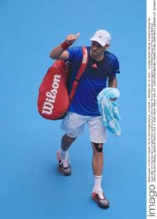 (151005) -- BEIJING, Oct. 5, 2015 -- Andreas Haider-Maurer of Austria leaves the court after winning the men s singles first round match of China Open Tennis Tournament against Jo-Wilfried Tsonga of France at National Tennis Center in Beijing, capital of China on Oct. 5, 2015. Haider-Maurer won 2-0. ) (SP)CHINA-BEIJING-TENNIS-CHINA OPEN-MEN S SINGLES-1ST ROUND(CN) XingxGuangli 