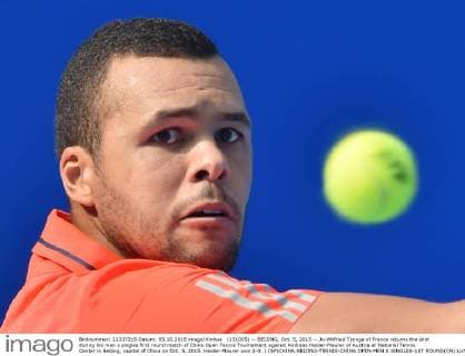 (151005) -- BEIJING, Oct. 5, 2015 -- Jo-Wilfried Tsonga of France returns the shot during his men s singles first round match of China Open Tennis Tournament against Andreas Haider-Maurer of Austria at National Tennis Center in Beijing, capital of China on Oct. 5, 2015. Haider-Maurer won 2-0. ) (SP)CHINA-BEIJING-TENNIS-CHINA OPEN-MEN S SINGLES-1ST ROUND(CN) LixWen 