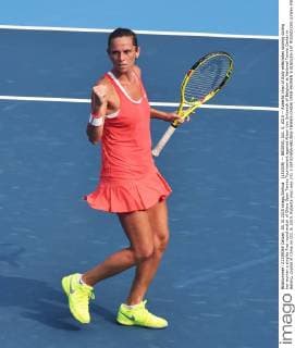 (151005) -- BEIJING, Oct. 5, 2015 -- Roberta Vinci of Italy celebrates scoring during her women s singles first round match of China Open Tennis Tournament against Alison Van Uytvanck of Belgium at National Tennis Center in Beijing, capital of China on Oct. 5, 2015. Roberta Vinci won 2-0. ) (SP)CHINA-BEIJING-TENNIS-CHINA OPEN-WOMEN S SINGLES-1ST ROUND(CN) LixWen 