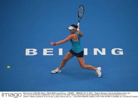 (151005) -- BEIJING, Oct. 5, 2015 -- Madison Brengle of the United States returns the shot during the women s singles first round match of China Open Tennis Tournament against Belinda Bencic of Switzerland at National Tennis Center in Beijing, capital of China on Oct. 5, 2015. Bencic won 2-1. ) (SP)CHINA-BEIJING-TENNIS-CHINA OPEN-WOMEN S SINGLES-1ST ROUND(CN) XingxGuangli 