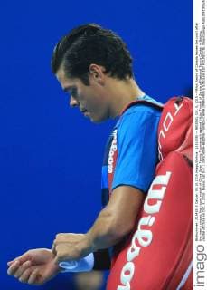 (151005) -- BEIJING, Oct. 5, 2015 -- Milos Raonic of Canada leaves the court after the men s singles first round match of China Open Tennis Tournament against Viktor Troicki of Serbia at National Tennis Center in Beijing, capital of China on Oct. 5, 2015. Raonic lost 0-2. ) (SP)CHINA-BEIJING-TENNIS-CHINA OPEN-MEN S SINGLES-1ST ROUND(CN) XingxGuangli 