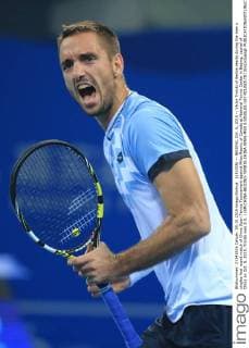 (151005) -- BEIJING, Oct. 5, 2015 -- Viktor Troicki of Serbia reacts during the men s singles first round match of China Open Tennis Tournament against Milos Raonic of Canada at National Tennis Center in Beijing, capital of China on Oct. 5, 2015. Troicki won 2-0. ) (SP)CHINA-BEIJING-TENNIS-CHINA OPEN-MEN S SINGLES-1ST ROUND(CN) XingxGuangli 