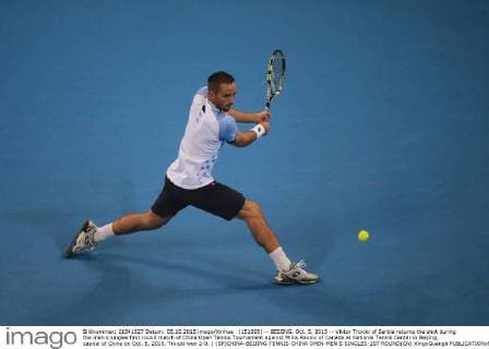 (151005) -- BEIJING, Oct. 5, 2015 -- Viktor Troicki of Serbia returns the shot during the men s singles first round match of China Open Tennis Tournament against Milos Raonic of Canada at National Tennis Center in Beijing, capital of China on Oct. 5, 2015. Troicki won 2-0. ) (SP)CHINA-BEIJING-TENNIS-CHINA OPEN-MEN S SINGLES-1ST ROUND(CN) XingxGuangli 