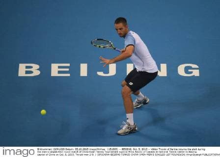(151005) -- BEIJING, Oct. 5, 2015 -- Viktor Troicki of Serbia returns the shot during the men s singles first round match of China Open Tennis Tournament against Milos Raonic of Canada at National Tennis Center in Beijing, capital of China on Oct. 5, 2015. Troicki won 2-0. ) (SP)CHINA-BEIJING-TENNIS-CHINA OPEN-MEN S SINGLES-1ST ROUND(CN) XingxGuangli 