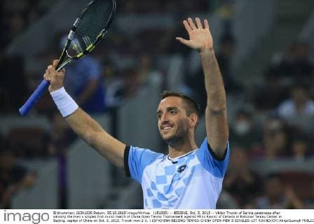 (151005) -- BEIJING, Oct. 5, 2015 -- Viktor Troicki of Serbia celebrates after winning the men s singles first round match of China Open Tennis Tournament against Milos Raonic of Canada at National Tennis Center in Beijing, capital of China on Oct. 5, 2015. Troicki won 2-0. ) (SP)CHINA-BEIJING-TENNIS-CHINA OPEN-MEN S SINGLES-1ST ROUND(CN) XingxGuangli 