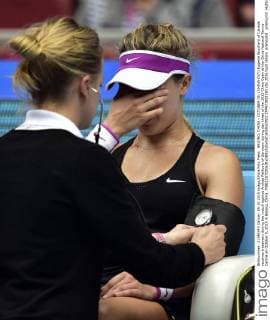 BEIJING, CHINA - OCTOBER 05: (CHINA OUT) Eugenie Bouchard of Canada receives treatment during the match against Andrea Petkovic of Germany during day three of the 2015 China Open at the China National Tennis Centre on October 5, 2015 in Beijing, China.  CFP473922190 