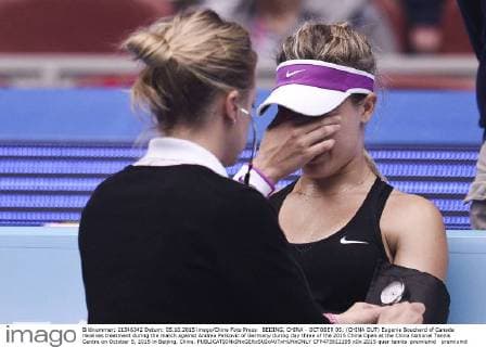 BEIJING, CHINA - OCTOBER 05: (CHINA OUT) Eugenie Bouchard of Canada receives treatment during the match against Andrea Petkovic of Germany during day three of the 2015 China Open at the China National Tennis Centre on October 5, 2015 in Beijing, China.  CFP473922195 
