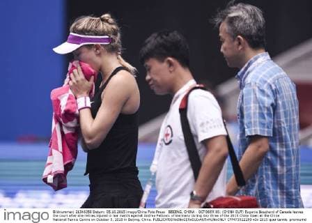 BEIJING, CHINA - OCTOBER 05: (CHINA OUT) Eugenie Bouchard of Canada leaves the court after she retires injured in her match against Andrea Petkovic of Germany during day three of the 2015 China Open at the China National Tennis Centre on October 5, 2015 in Beijing, China.  CFP473922193 