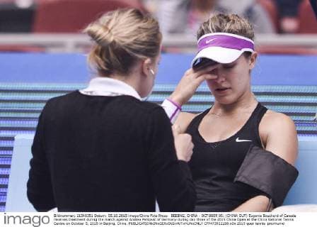 BEIJING, CHINA - OCTOBER 05: (CHINA OUT) Eugenie Bouchard of Canada receives treatment during the match against Andrea Petkovic of Germany during day three of the 2015 China Open at the China National Tennis Centre on October 5, 2015 in Beijing, China.  CFP473922196 