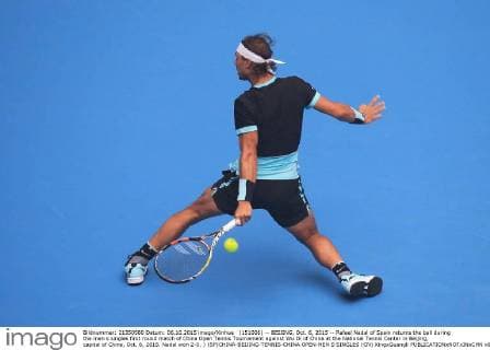(151006) -- BEIJING, Oct. 6, 2015 -- Rafael Nadal of Spain returns the ball during the men s singles first round match of China Open Tennis Tournament against Wu Di of China at the National Tennis Center in Beijing, capital of China, Oct. 6, 2015. Nadal won 2-0. ) (SP)CHINA-BEIJING-TENNIS-CHINA OPEN-MEN S SINGLES (CN) XingxGuangli 