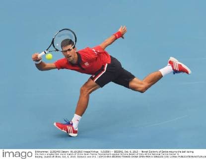 (151006) -- BEIJING, Oct. 6, 2015 -- Novak Djokovic of Serbia returns the ball during the men s singles first round match of China Open Tennis Tournament against Simone Bolelli of Italy at the National Tennis Center in Beijing, capital of China, Oct. 6, 2015. Djokovic won 2-0. ) (SP)CHINA-BEIJING-TENNIS-CHINA OPEN-MEN S SINGLES (CN) LixWen 