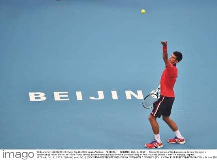 (151006) -- BEIJING, Oct. 6, 2015 -- Novak Djokovic of Serbia serves during the men s singles first round match of China Open Tennis Tournament against Simone Bolelli of Italy at the National Tennis Center in Beijing, capital of China, Oct. 6, 2015. Djokovic won 2-0. ) (SP)CHINA-BEIJING-TENNIS-CHINA OPEN-MEN S SINGLES (CN) LixWen 