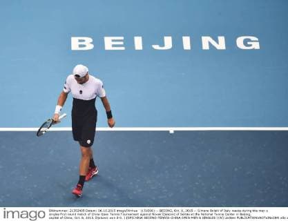 (151006) -- BEIJING, Oct. 6, 2015 -- Simone Bolelli of Italy reacts during the men s singles first round match of China Open Tennis Tournament against Novak Djokovic of Serbia at the National Tennis Center in Beijing, capital of China, Oct. 6, 2015. Djokovic won 2-0. ) (SP)CHINA-BEIJING-TENNIS-CHINA OPEN-MEN S SINGLES (CN) LixWen 