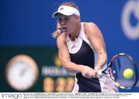 BEIJING, CHINA - OCTOBER 06: (CHINA OUT) Caroline Wozniacki of Denmark returns a shot against Wang Qiang of China during day four of the 2015 China Open at the China National Tennis Centre on October 6, 2015 in Beijing, China.  CFP473945994 
