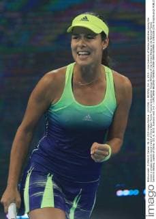 (151006) -- BEIJING, Oct. 6, 2015 -- Ana Ivanovic of Serbia celebrates during the women s singles second round match of China Open Tennis Tournament against Venus Williams of the United States at the National Tennis Center in Beijing, capital of China, Oct. 6, 2015. Ivanovic won 2-0. ) (SP)CHINA-BEIJING-TENNIS-CHINA OPEN-WOMEN S SINGLES (CN) XingxGuangli 