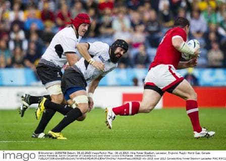 06.10.2015. King Power Stadium, Leicester, England. Rugby World Cup. Canada versus Romania. Aaron Carpenter of Canada runs past Viorel Lucaci of Romania. xGrahamxWilsonx  ActionPlus11669629
