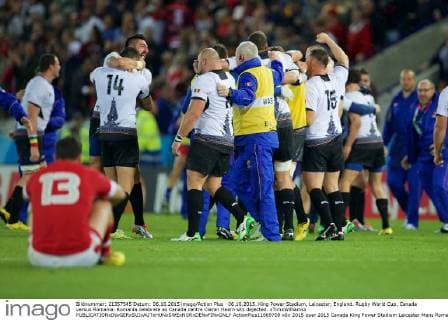 06.10.2015. King Power Stadium, Leicester, England. Rugby World Cup. Canada versus Romania. Romania celebrate as Canada centre Ciaran Hearn sits dejected. xTimxWilliamsx  ActionPlus11669709