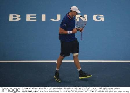 (151007) -- BEIJING, Oct. 7, 2015 -- John Isner of the United States reacts during the men s singles first round match of China Open Tennis Tournament against Dominic Thiem of Austria at the National Tennis Center in Beijing, capital of China, Oct. 6, 2015. John Isner won 2-0. ) (SP)CHINA-BEIJING-TENNIS-CHINA OPEN-MEN S SINGLES (CN) XingxGuangli 
