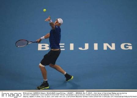 (151007) -- BEIJING, Oct. 7, 2015 -- John Isner of the United States serves during the men s singles first round match of China Open Tennis Tournament against Dominic Thiem of Austria at the National Tennis Center in Beijing, capital of China, Oct. 6, 2015. John Isner won 2-0. ) (SP)CHINA-BEIJING-TENNIS-CHINA OPEN-MEN S SINGLES (CN) XingxGuangli 