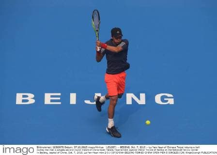 (151007) -- BEIJING, Oct. 7, 2015 -- Lu Yen-Hsun of Chinese Taipei returns a ball during the men s singles second round match of China Open Tennis Tournament against Viktor Troicki of Serbia at the National Tennis Center in Beijing, capital of China, Oct. 7, 2015. Lu Yen-Hsun won 2-0.) (SP)CHINA-BEIJING-TENNIS-CHINA OPEN-MEN S SINGLES (CN) XingxGuangli 