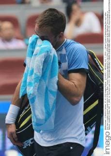 (151007) -- BEIJING, Oct. 7, 2015 -- Viktor Troicki of Serbia leaves the court after the men s singles second round match of China Open Tennis Tournament against Lu Yen-Hsun of Chinese Taipei at the National Tennis Center in Beijing, capital of China, Oct. 7, 2015. Lu Yen-Hsun won 2-0.) (SP)CHINA-BEIJING-TENNIS-CHINA OPEN-MEN S SINGLES (CN) XingxGuangli 