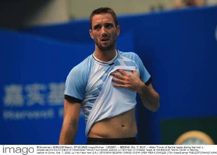 (151007) -- BEIJING, Oct. 7, 2015 -- Viktor Troicki of Serbia reacts during the men s singles second round match of China Open Tennis Tournament against Lu Yen-Hsun of Chinese Taipei at the National Tennis Center in Beijing, capital of China, Oct. 7, 2015. Lu Yen-Hsun won 2-0.) (SP)CHINA-BEIJING-TENNIS-CHINA OPEN-MEN S SINGLES (CN) XingxGuangli 