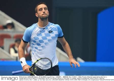 (151007) -- BEIJING, Oct. 7, 2015 -- Viktor Troicki of Serbia reacts during the men s singles second round match of China Open Tennis Tournament against Lu Yen-Hsun of Chinese Taipei at the National Tennis Center in Beijing, capital of China, Oct. 7, 2015. Lu Yen-Hsun won 2-0.) (SP)CHINA-BEIJING-TENNIS-CHINA OPEN-MEN S SINGLES (CN) XingxGuangli 