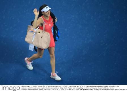(151007) -- BEIJING, Oct. 7, 2015 -- Agnieszka Radwanska of Poland gestures to the audience after the women s singles third round match of China Open Tennis Tournament against Madison Keys of the United States at the National Tennis Center in Beijing, capital of China, Oct. 7, 2015. Agnieszka Radwanska was qualified for the next round after Madison Keys retired from the match.) (SP)CHINA-BEIJING-TENNIS-CHINA OPEN-WOMEN S SINGLES (CN) XingxGuangli 