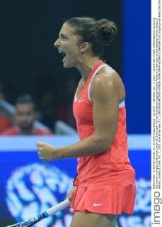 (151007) -- BEIJING, Oct. 7, 2015 -- Sara Errani of Italy celebrates scoring during the women s singles third round match of China Open Tennis Tournament against Andrea Petkovic of Germany at the National Tennis Center in Beijing, capital of China, Oct. 7, 2015. Sara Errani won 2-1.) (SP)CHINA-BEIJING-TENNIS-CHINA OPEN-WOMEN S SINGLES (CN) XingxGuangli 