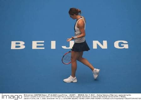 (151007) -- BEIJING, Oct. 7, 2015 -- Andrea Petkovic of Germany reacts during the women s singles third round match of China Open Tennis Tournament against Sara Errani of Italy at the National Tennis Center in Beijing, capital of China, Oct. 7, 2015. Sara Errani won 2-1.) (SP)CHINA-BEIJING-TENNIS-CHINA OPEN-WOMEN S SINGLES (CN) XingxGuangli 