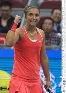(151007) -- BEIJING, Oct. 7, 2015 -- Sara Errani of Italy celebrates scoring during the women s singles third round match of China Open Tennis Tournament against Andrea Petkovic of Germany at the National Tennis Center in Beijing, capital of China, Oct. 7, 2015. Sara Errani won 2-1.) (SP)CHINA-BEIJING-TENNIS-CHINA OPEN-WOMEN S SINGLES (CN) XingxGuangli 