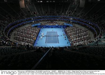 (151007) -- BEIJING, Oct. 7, 2015 -- Rafael Nadal(Top) of Spain serves during the men s singles second round match of China Open Tennis Tournament against Vasek Pospisil of Canada at the National Tennis Center in Beijing, capital of China, Oct. 7, 2015. )(wll) (SP)CHINA-BEIJING-TENNIS-CHINA OPEN-MEN S SINGLES (CN) XingxGuangli 