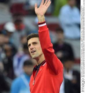 (151008) -- BEIJING, Oct. 8, 2015 -- Novak Djokovic of Serbia waves to the audience after winning the men s singles second round match against Zhang Ze of China at the China Open tennis tournament in Beijing, China, Oct. 8, 2015. Djokovic was qualified for the next round after beating Zhang 2-0. ) (SP)CHINA-BEIJING-TENNIS-CHINA OPEN-MEN S SINGLES-DJOKOVIC LixWen 