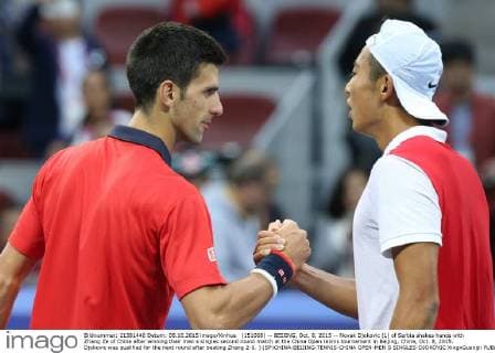 (151008) -- BEIJING, Oct. 8, 2015 -- Novak Djokovic (L) of Serbia shakes hands with Zhang Ze of China after winning their men s singles second round match at the China Open tennis tournament in Beijing, China, Oct. 8, 2015. Djokovic was qualified for the next round after beating Zhang 2-0. ) (SP)CHINA-BEIJING-TENNIS-CHINA OPEN-MEN S SINGLES-DJOKOVIC XingxGuangli 
